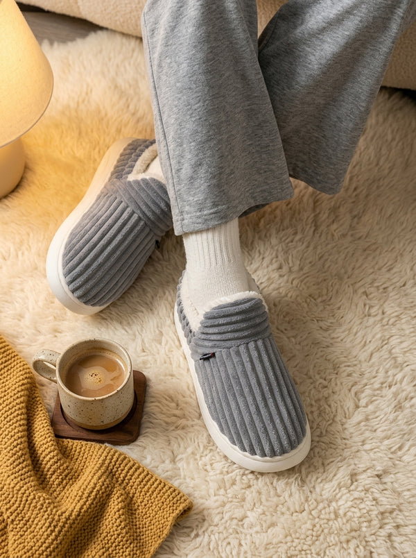 Pantuflas puestas en los pies